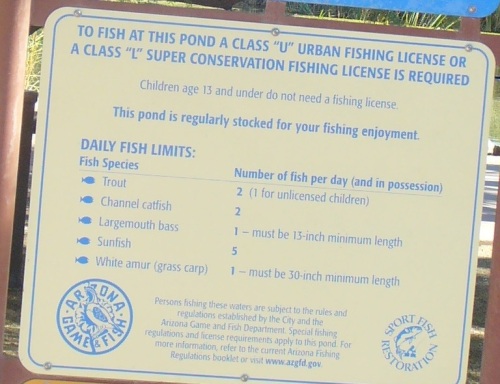 Sign in English at Phoenix Papago Park that has the fishing rules on it. 
                     The English fishing rules are different then the Spanish fishing rules